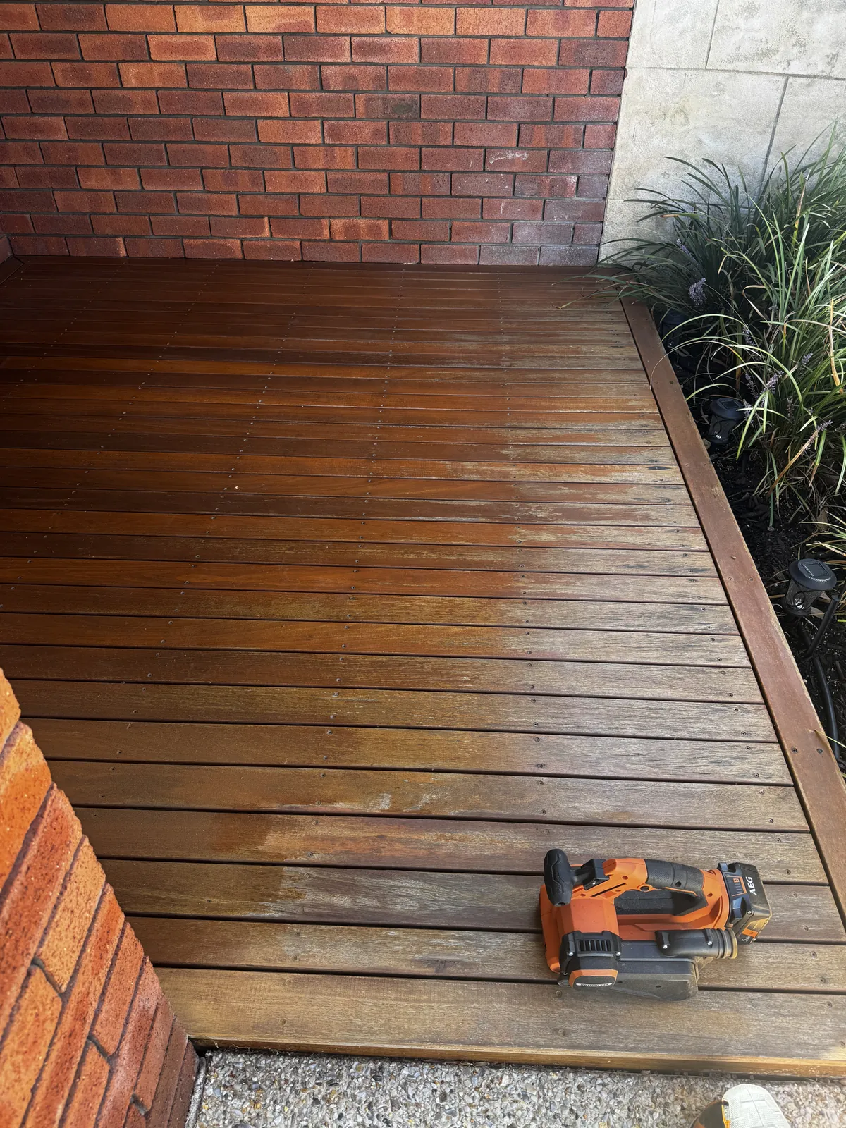 Tired merbau deck before restoration