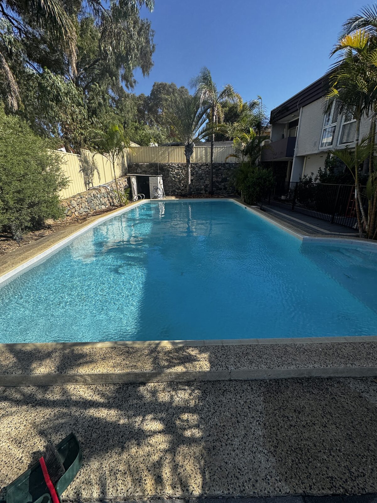 Clear blue water after a Macca's pool service